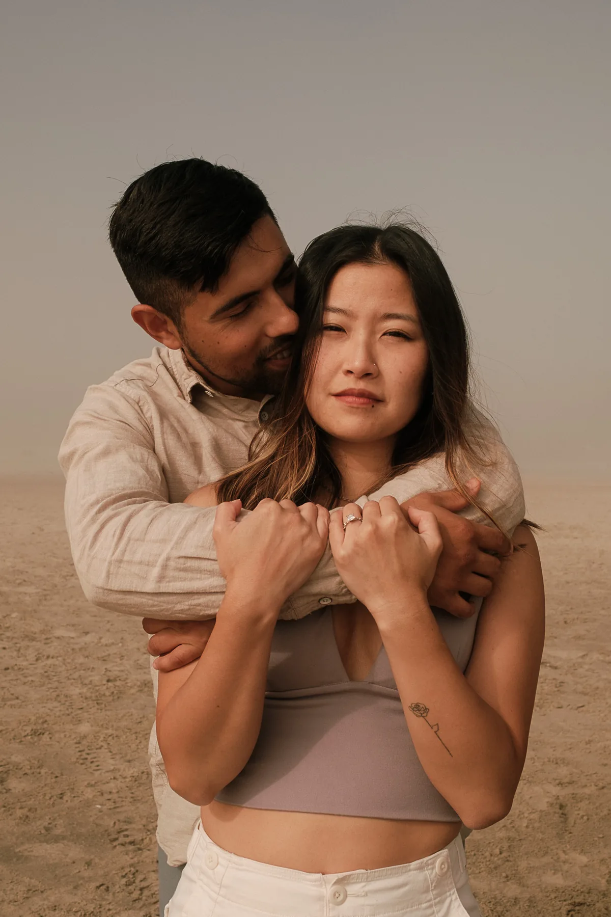 Couple sharing a quiet beach portrait