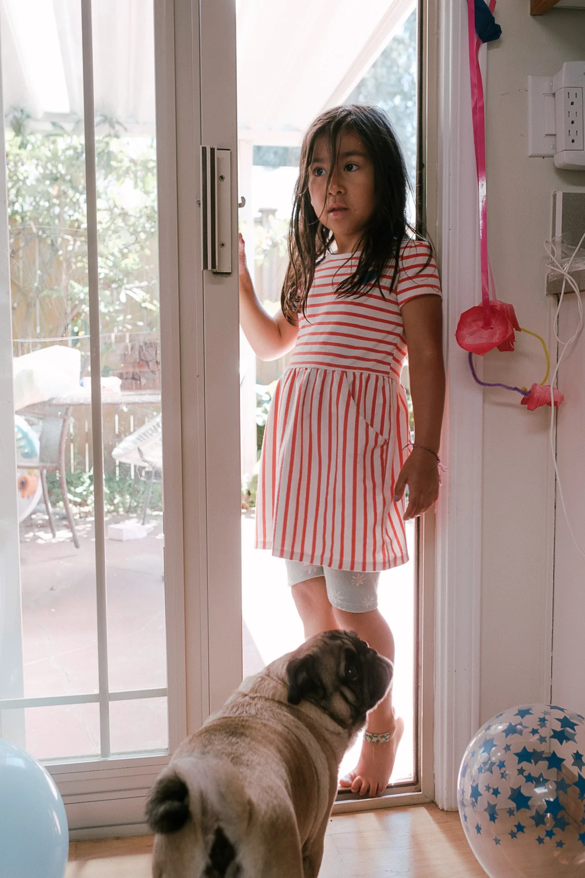 Child and dog at the open door